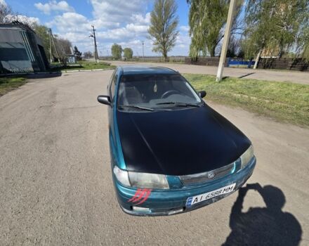 Зеленый Мазда 323, объемом двигателя 1.3 л и пробегом 510 тыс. км за 1400 $, фото 1 на Automoto.ua