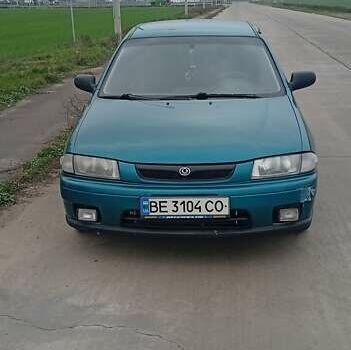 Зелений Мазда 323, об'ємом двигуна 1.49 л та пробігом 150 тис. км за 1800 $, фото 1 на Automoto.ua