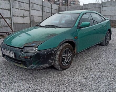 Зелений Мазда 323, об'ємом двигуна 1.5 л та пробігом 100 тис. км за 474 $, фото 1 на Automoto.ua