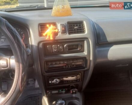 Зеленый Мазда 323, объемом двигателя 1.49 л и пробегом 319 тыс. км за 2600 $, фото 1 на Automoto.ua