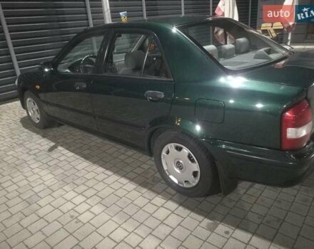 Зеленый Мазда 323, объемом двигателя 1.5 л и пробегом 335 тыс. км за 2900 $, фото 1 на Automoto.ua
