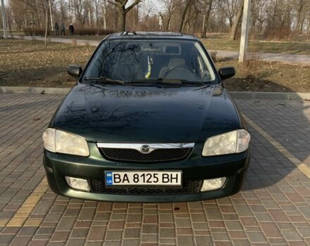 Зеленый Мазда 323, объемом двигателя 1.5 л и пробегом 260 тыс. км за 2600 $, фото 1 на Automoto.ua