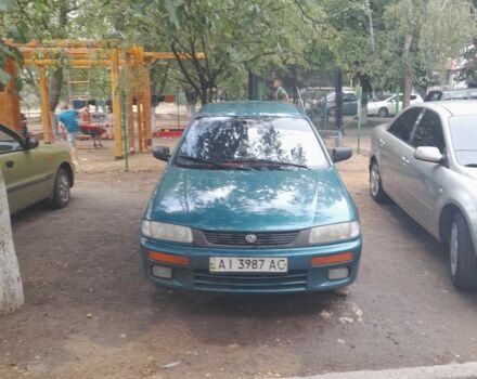 Зеленый Мазда 323, объемом двигателя 1 л и пробегом 250 тыс. км за 1500 $, фото 1 на Automoto.ua