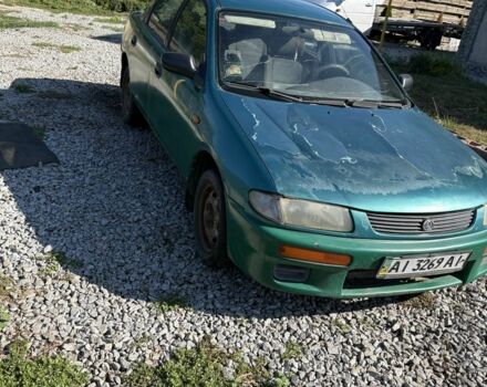 Зелений Мазда 323, об'ємом двигуна 1.8 л та пробігом 150 тис. км за 502 $, фото 1 на Automoto.ua