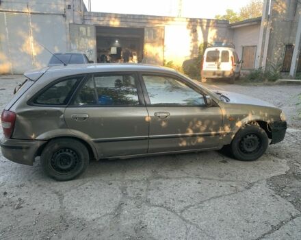 Зелений Мазда 323, об'ємом двигуна 1.5 л та пробігом 304 тис. км за 1000 $, фото 1 на Automoto.ua