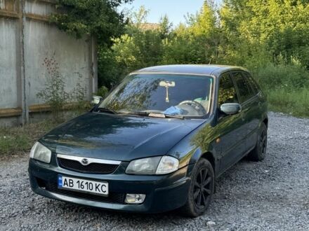 Зеленый Мазда 323, объемом двигателя 2 л и пробегом 324 тыс. км за 2050 $, фото 1 на Automoto.ua