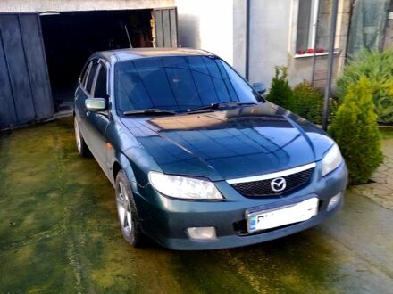 Зеленый Мазда 323, объемом двигателя 2 л и пробегом 210 тыс. км за 3000 $, фото 1 на Automoto.ua