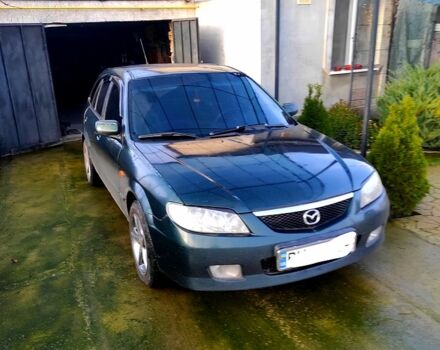 Зеленый Мазда 323, объемом двигателя 2 л и пробегом 210 тыс. км за 3000 $, фото 1 на Automoto.ua