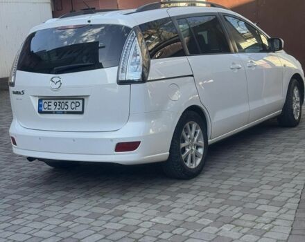 Белый Мазда 5, объемом двигателя 2 л и пробегом 240 тыс. км за 7000 $, фото 1 на Automoto.ua