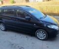 Черный Мазда 5, объемом двигателя 1.8 л и пробегом 199 тыс. км за 4000 $, фото 1 на Automoto.ua