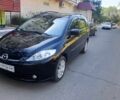 Черный Мазда 5, объемом двигателя 1.8 л и пробегом 199 тыс. км за 4000 $, фото 1 на Automoto.ua