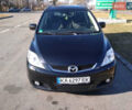 Черный Мазда 5, объемом двигателя 2 л и пробегом 318 тыс. км за 6300 $, фото 1 на Automoto.ua