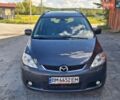 Черный Мазда 5, объемом двигателя 2 л и пробегом 368 тыс. км за 4150 $, фото 1 на Automoto.ua