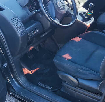 Черный Мазда 5, объемом двигателя 2 л и пробегом 325 тыс. км за 6200 $, фото 5 на Automoto.ua