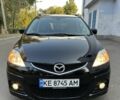 Черный Мазда 5, объемом двигателя 1.8 л и пробегом 185 тыс. км за 6000 $, фото 1 на Automoto.ua