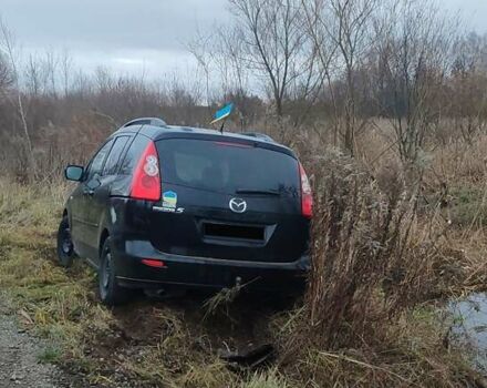 Черный Мазда 5, объемом двигателя 2 л и пробегом 300 тыс. км за 2600 $, фото 1 на Automoto.ua