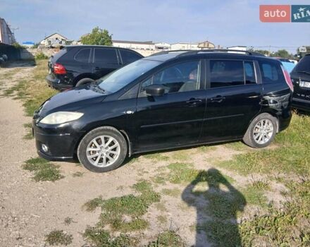 Черный Мазда 5, объемом двигателя 2 л и пробегом 239 тыс. км за 6300 $, фото 1 на Automoto.ua