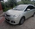 Желтый Мазда 5, объемом двигателя 2 л и пробегом 235 тыс. км за 7000 $, фото 1 на Automoto.ua