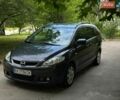 Серый Мазда 5, объемом двигателя 2 л и пробегом 264 тыс. км за 4500 $, фото 1 на Automoto.ua