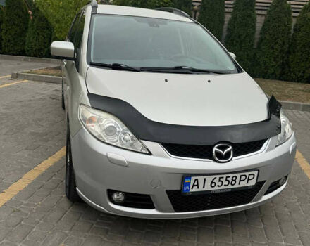 Серый Мазда 5, объемом двигателя 2 л и пробегом 210 тыс. км за 6800 $, фото 1 на Automoto.ua