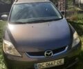 Серый Мазда 5, объемом двигателя 2 л и пробегом 223 тыс. км за 5200 $, фото 1 на Automoto.ua
