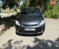 Серый Мазда 5, объемом двигателя 2 л и пробегом 255 тыс. км за 5800 $, фото 1 на Automoto.ua