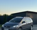 Серый Мазда 5, объемом двигателя 2 л и пробегом 320 тыс. км за 3850 $, фото 1 на Automoto.ua