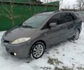 Серый Мазда 5, объемом двигателя 2 л и пробегом 302 тыс. км за 4700 $, фото 1 на Automoto.ua