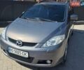 Серый Мазда 5, объемом двигателя 2 л и пробегом 301 тыс. км за 5400 $, фото 1 на Automoto.ua