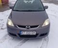 Серый Мазда 5, объемом двигателя 2 л и пробегом 258 тыс. км за 4800 $, фото 1 на Automoto.ua