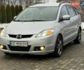 Серый Мазда 5, объемом двигателя 2 л и пробегом 320 тыс. км за 4650 $, фото 1 на Automoto.ua