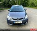 Серый Мазда 5, объемом двигателя 2 л и пробегом 210 тыс. км за 4600 $, фото 1 на Automoto.ua