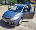 Серый Мазда 5, объемом двигателя 2 л и пробегом 231 тыс. км за 6500 $, фото 1 на Automoto.ua