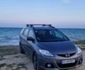 Серый Мазда 5, объемом двигателя 2 л и пробегом 290 тыс. км за 6474 $, фото 1 на Automoto.ua