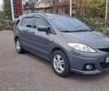Серый Мазда 5, объемом двигателя 2 л и пробегом 300 тыс. км за 5499 $, фото 1 на Automoto.ua
