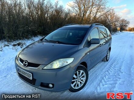Серый Мазда 5, объемом двигателя 2 л и пробегом 250 тыс. км за 4850 $, фото 1 на Automoto.ua