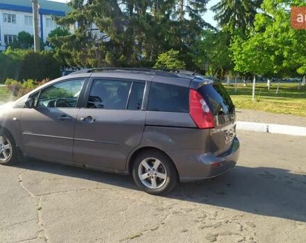 Серый Мазда 5, объемом двигателя 2 л и пробегом 250 тыс. км за 4499 $, фото 1 на Automoto.ua