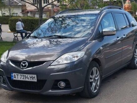 Серый Мазда 5, объемом двигателя 2 л и пробегом 236 тыс. км за 7000 $, фото 1 на Automoto.ua