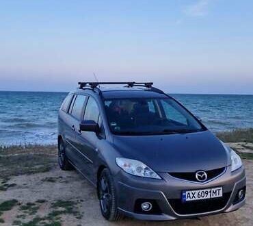 Серый Мазда 5, объемом двигателя 2 л и пробегом 290 тыс. км за 6474 $, фото 1 на Automoto.ua