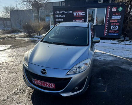 Серый Мазда 5, объемом двигателя 2 л и пробегом 98 тыс. км за 9499 $, фото 1 на Automoto.ua