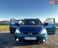 Синий Мазда 5, объемом двигателя 2 л и пробегом 215 тыс. км за 5500 $, фото 1 на Automoto.ua