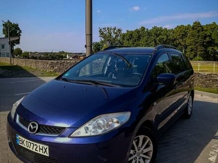 Синий Мазда 5, объемом двигателя 2 л и пробегом 255 тыс. км за 5800 $, фото 1 на Automoto.ua