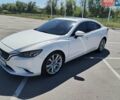 Белый Мазда 6, объемом двигателя 2.5 л и пробегом 142 тыс. км за 13700 $, фото 1 на Automoto.ua