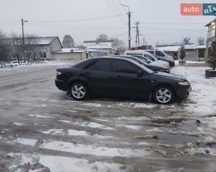 Черный Мазда 6, объемом двигателя 2 л и пробегом 350 тыс. км за 2400 $, фото 1 на Automoto.ua