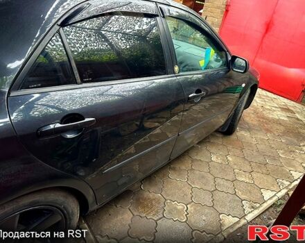 Черный Мазда 6, объемом двигателя 2 л и пробегом 270 тыс. км за 3300 $, фото 1 на Automoto.ua