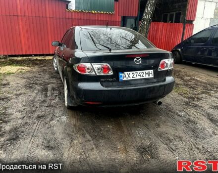 Черный Мазда 6, объемом двигателя 2 л и пробегом 300 тыс. км за 3000 $, фото 1 на Automoto.ua