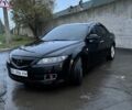 Черный Мазда 6, объемом двигателя 1.8 л и пробегом 301 тыс. км за 3800 $, фото 1 на Automoto.ua