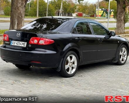 Черный Мазда 6, объемом двигателя 2.3 л и пробегом 250 тыс. км за 3300 $, фото 2 на Automoto.ua