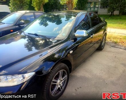 Черный Мазда 6, объемом двигателя 2 л и пробегом 203 тыс. км за 5300 $, фото 1 на Automoto.ua
