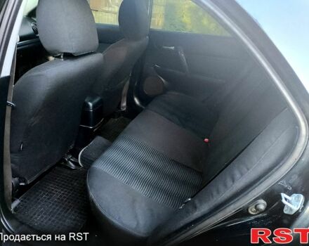 Черный Мазда 6, объемом двигателя 2 л и пробегом 215 тыс. км за 4900 $, фото 2 на Automoto.ua